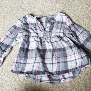 Pink and grey long sleeve top.